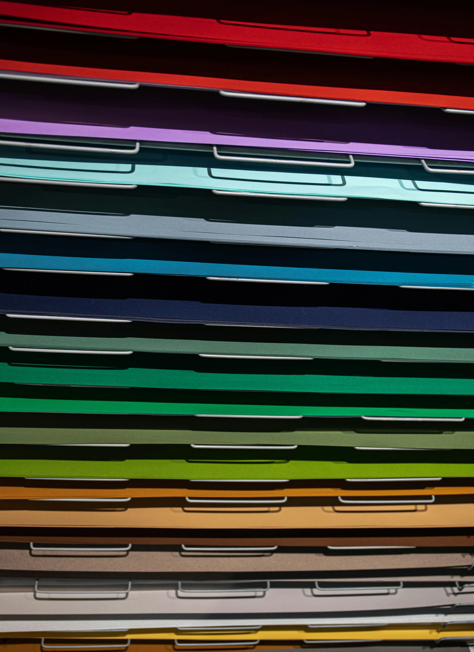 a stack of colorful folders stacked on top of each other, inspired by Joel Shapiro, unsplash, color field, 256 colors, office ceiling panels, 9 9 designs, in 2 0 1 2