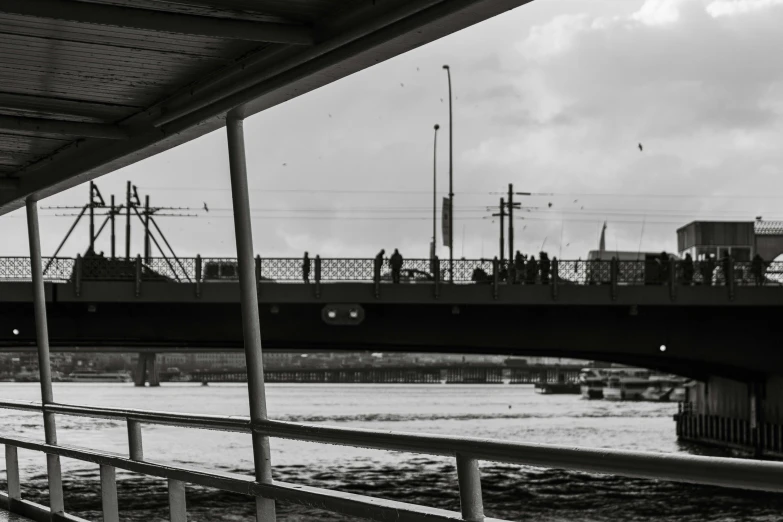 a bridge spanning over water with power lines