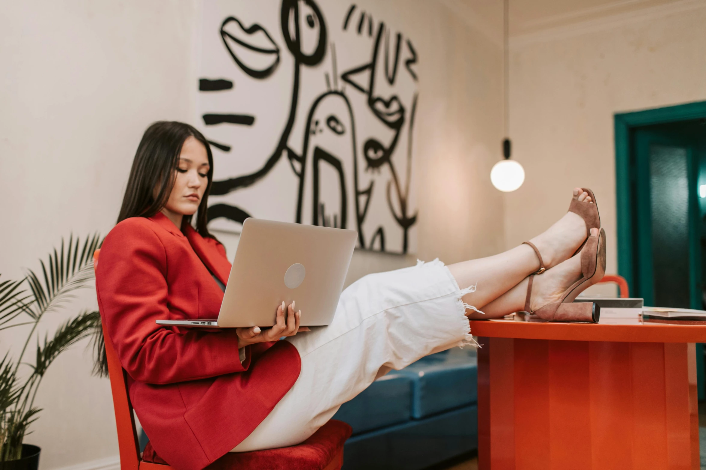 a woman sitting at a table with a laptop, trending on pexels, maximalism, a woman wearing red high heels, wearing red jacket, 🦩🪐🐞👩🏻🦳, office clothes