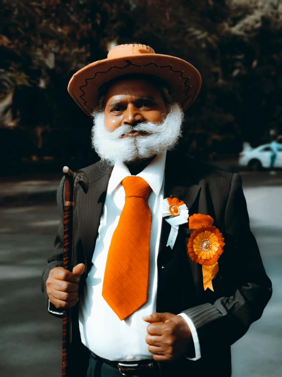 a man with a white beard and orange tie, inspired by Bapu, pexels contest winner, celebration costume, tanned, (((rusty))), version 3