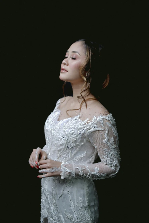 a woman in a wedding dress posing for a picture, a portrait, inspired by Rudy Siswanto, looking off to the side, ((portrait)), long sleeves, advertising photo