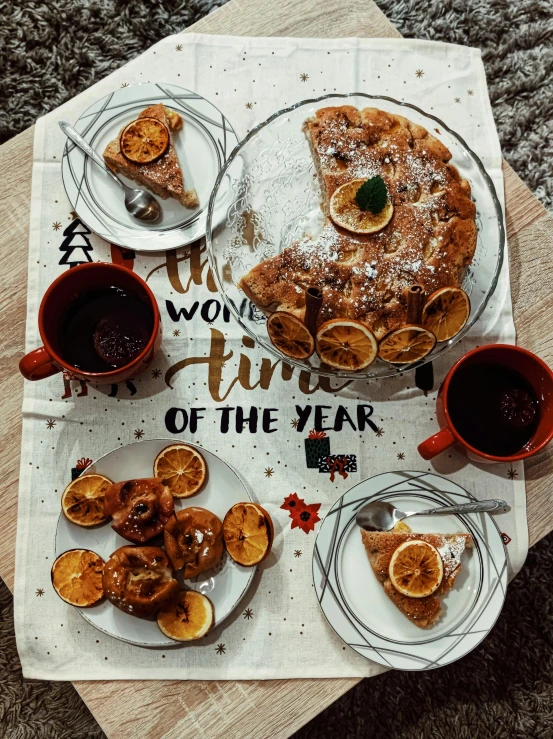 a table topped with plates of food and cups of coffee, by Lucia Peka, pexels contest winner, apple pie, winter time, avatar image