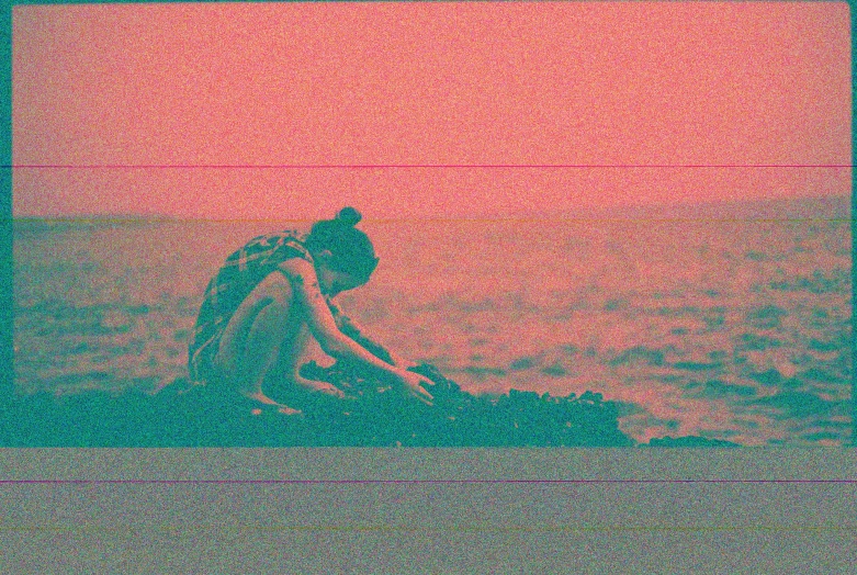 a woman sitting on top of a beach next to the ocean, inspired by Gustave Boulanger, video art, super 8mm, in the colors hot pink and cyan, vhs glitch, duotone