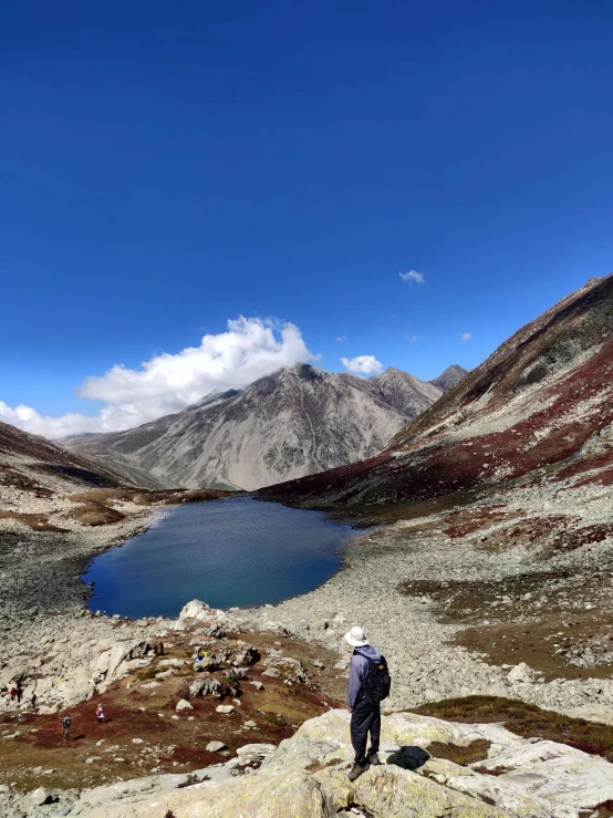 a person standing on the side of a mountain