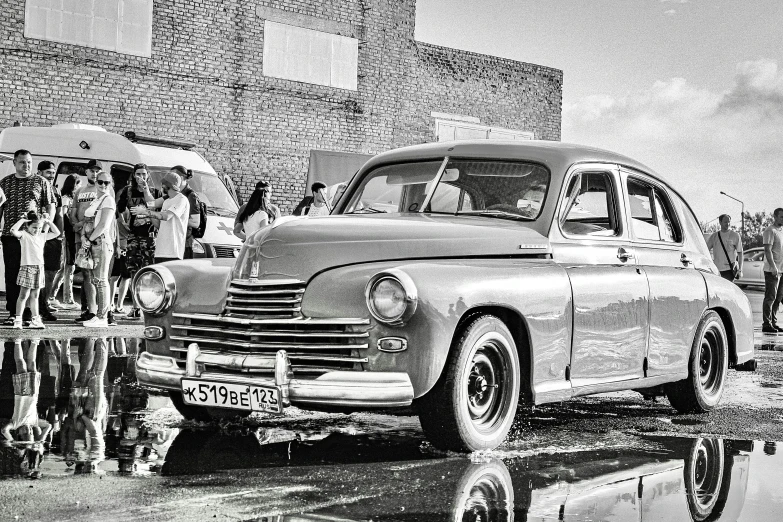 a black and white photo of an old car, a black and white photo, by andrei riabovitchev, retrofuturism, 000 — википедия, magical soviet town, desaturated!!, highly polished