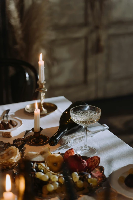 an elaborate setting consisting of silverware, plates, and glasses