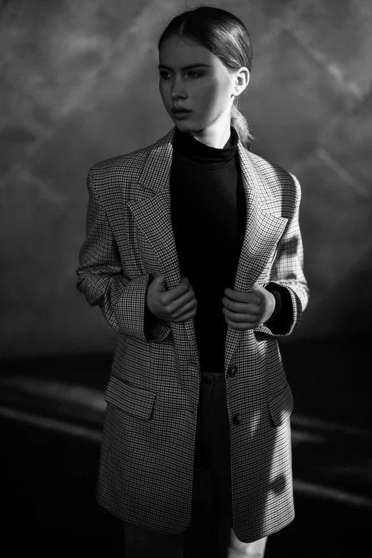 a black and white photo of a woman in a coat, trending on pexels, cai xukun, sun-hyuk kim, suit, crosshatch
