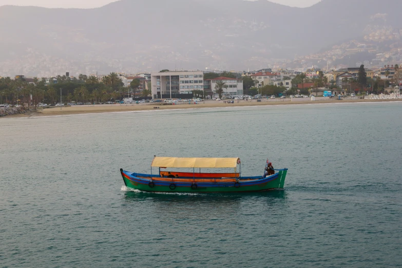 a small boat in the middle of a body of water, hurufiyya, profile image, otjize, the city of santa barbara, tourist photo