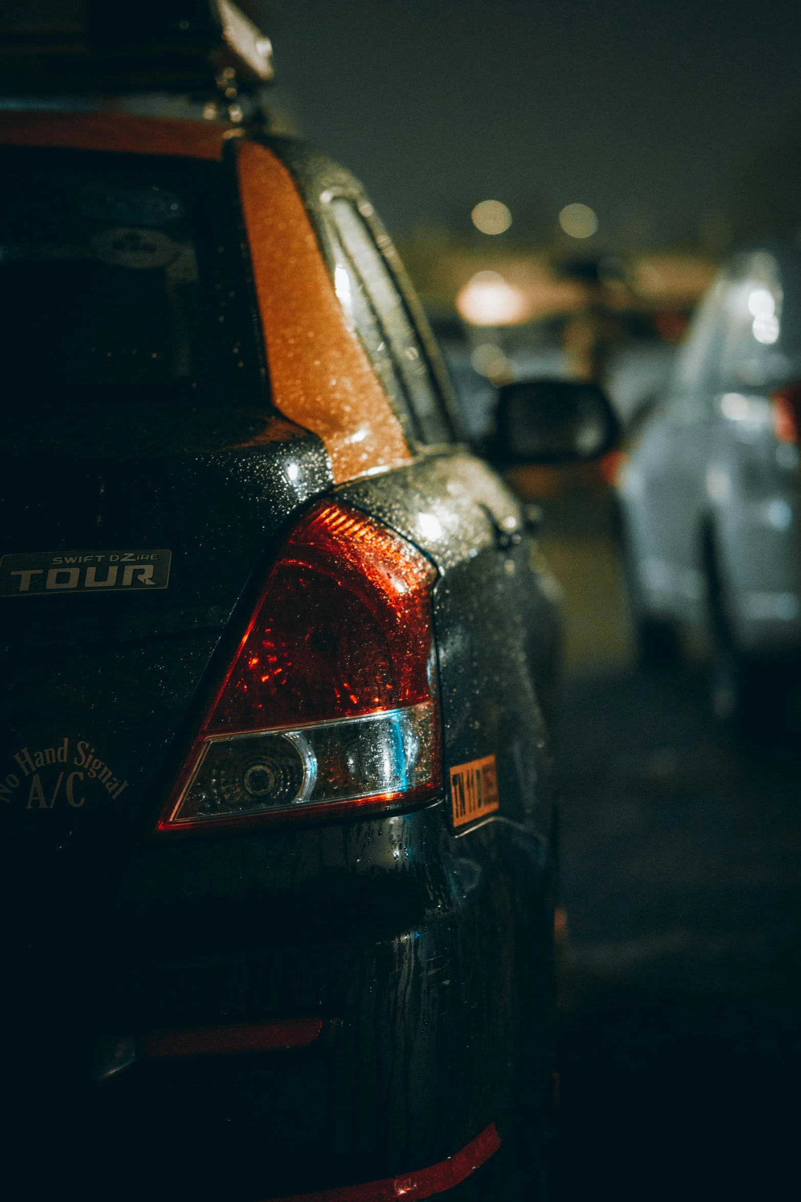 the rear end of cars parked in the street