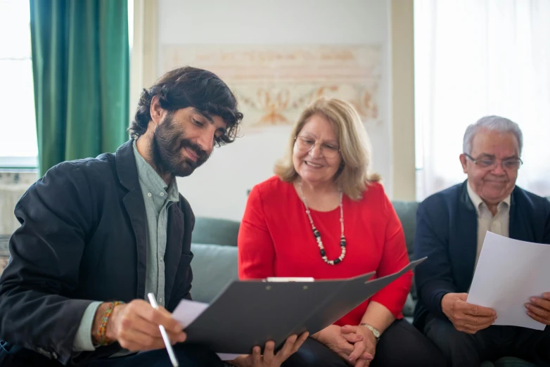 a group of people sitting on top of a couch, pexels contest winner, renaissance, signing a bill, navid negahban, barbara canepa, in meeting together