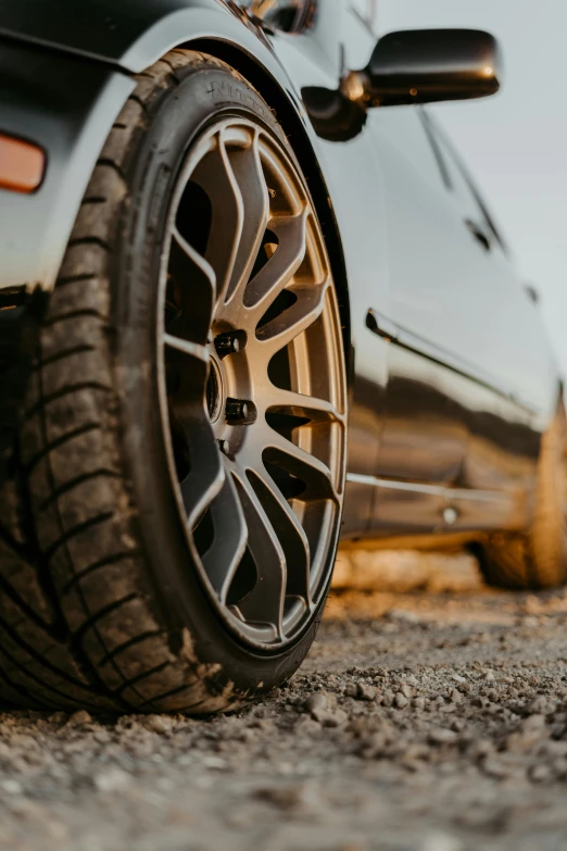 a car parked on the side of the road, pexels contest winner, renaissance, detailed alloy wheels, smokey tires, brown, super detailed image