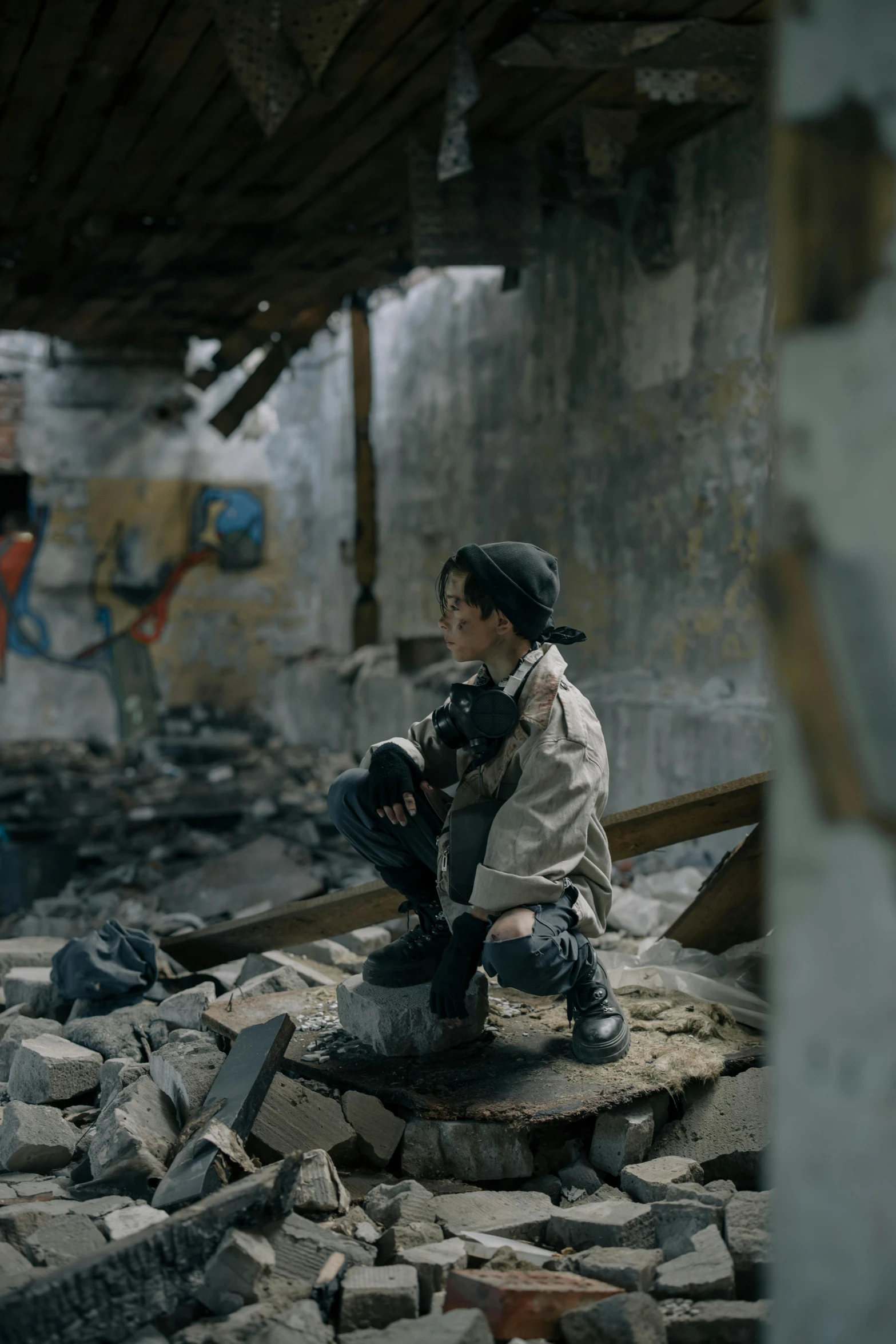 a man sitting on top of a pile of rubble, unsplash contest winner, graffiti, weta disney movie still photo, girls' last tour, little boy, holding a bomb