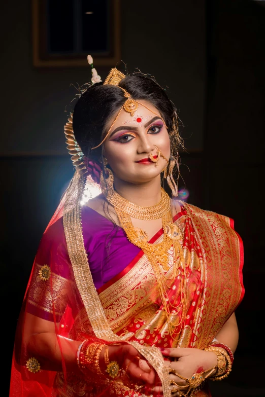 a woman dressed in a red and gold sari, by Sudip Roy, portrait 8 k, slide show, real image, indian girl with brown skin