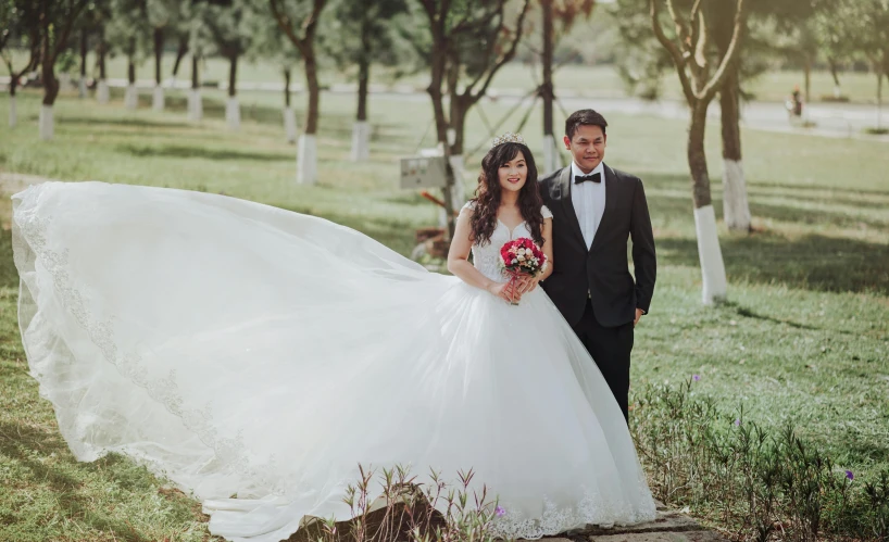 a man in a tuxedo and a woman in a wedding dress, pexels contest winner, asian female, sunny day time, fantasy land, aykut aydogdu
