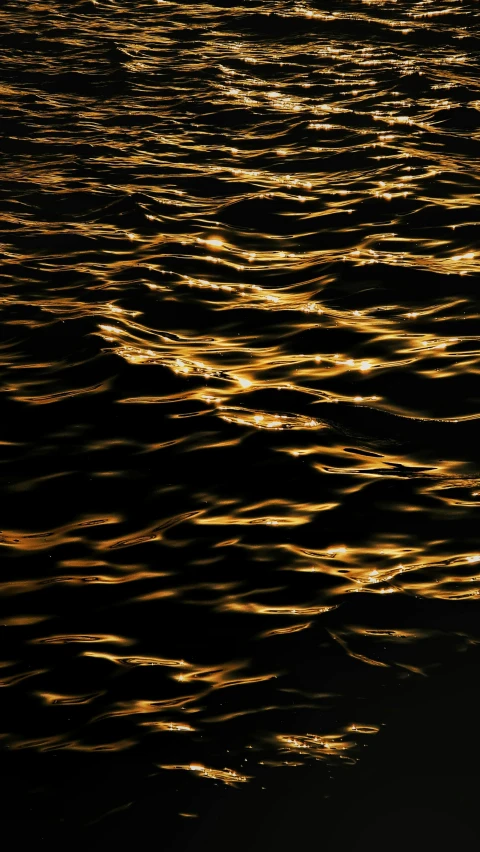 a boat floating on top of a body of water, an album cover, inspired by Andreas Gursky, pexels, hurufiyya, bright glowing veins, golden glistening, glow wave, reflection on the oil