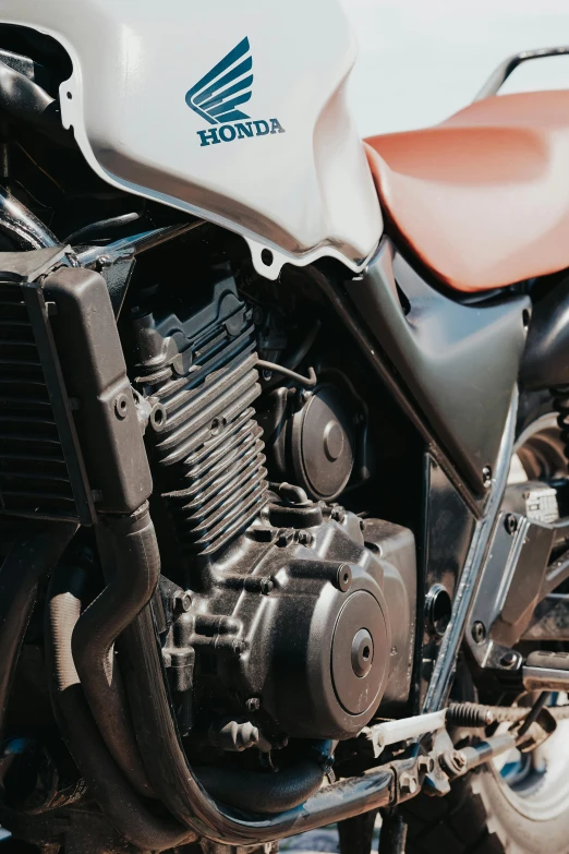 a close up of a motorcycle parked on a street, profile image, featuring engine, 3 dimensional, technical detail