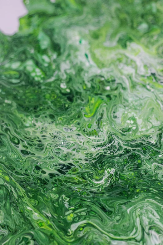 a close up of green paint on a white surface, a detailed painting, inspired by Art Green, reddit, abstract art, chaotic swirling ferrofluids, lush alien landscape, monochromatic green, blissful