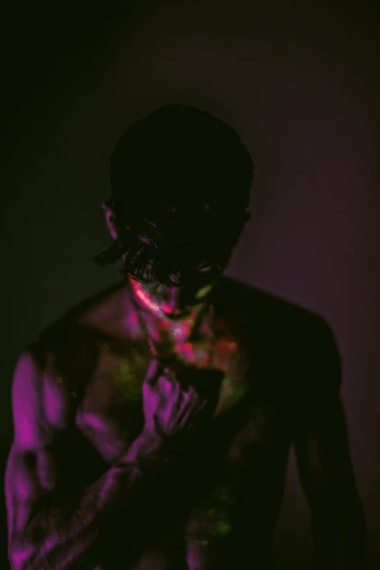 a man that is standing in the dark, an album cover, inspired by Elsa Bleda, pexels contest winner, art photography, colorful muscular eldritch, young thug, bleeding colors, black face