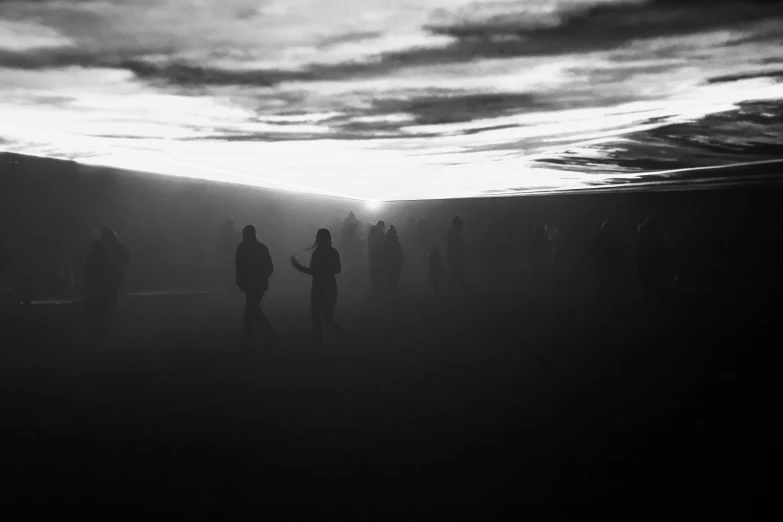 a black and white photo of a group of people, by Mirko Rački, pexels contest winner, conceptual art, dawn atmosphere, olafur eliasson, nightmare landscape, travellers