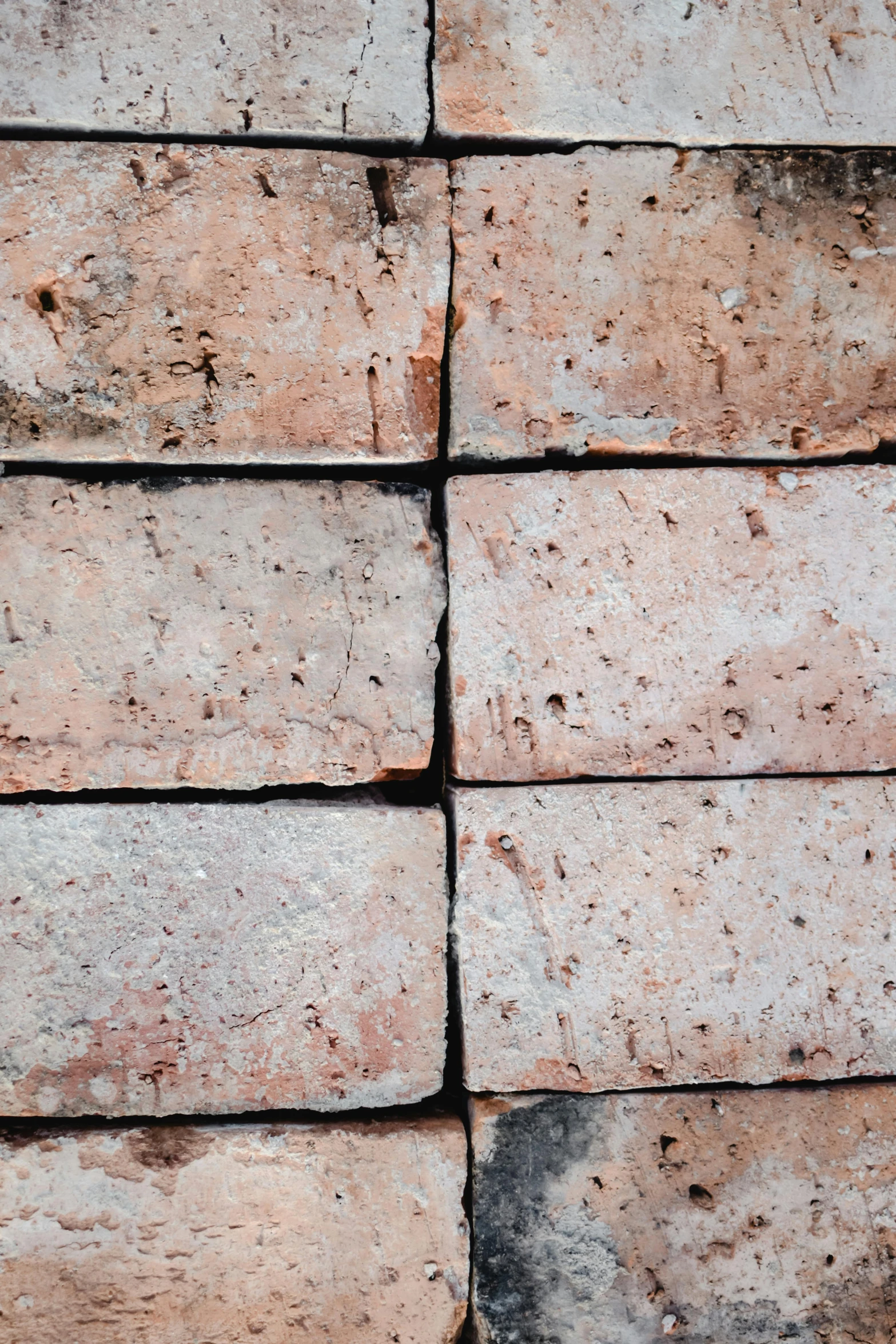 some bricks stacked together in a field