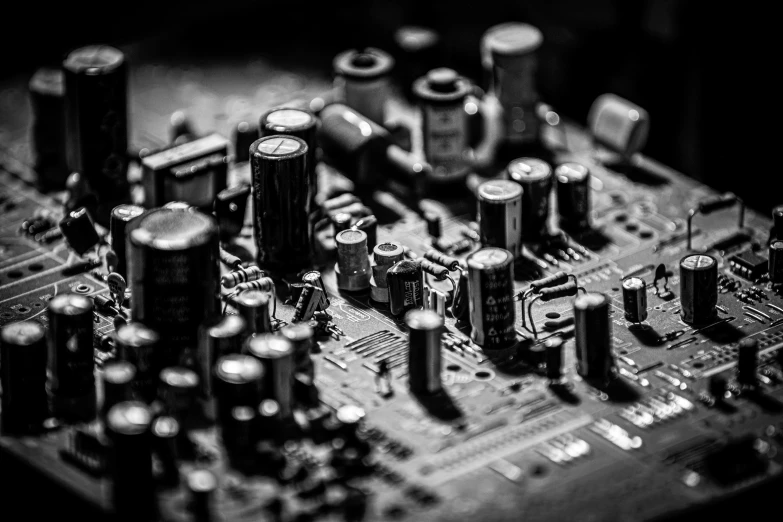 a black and white photo of electronic components, a macro photograph, by Aleksander Kobzdej, pexels, music is life, tectonic cityscape, old experimentation cabinet, hyperdetailed!!!