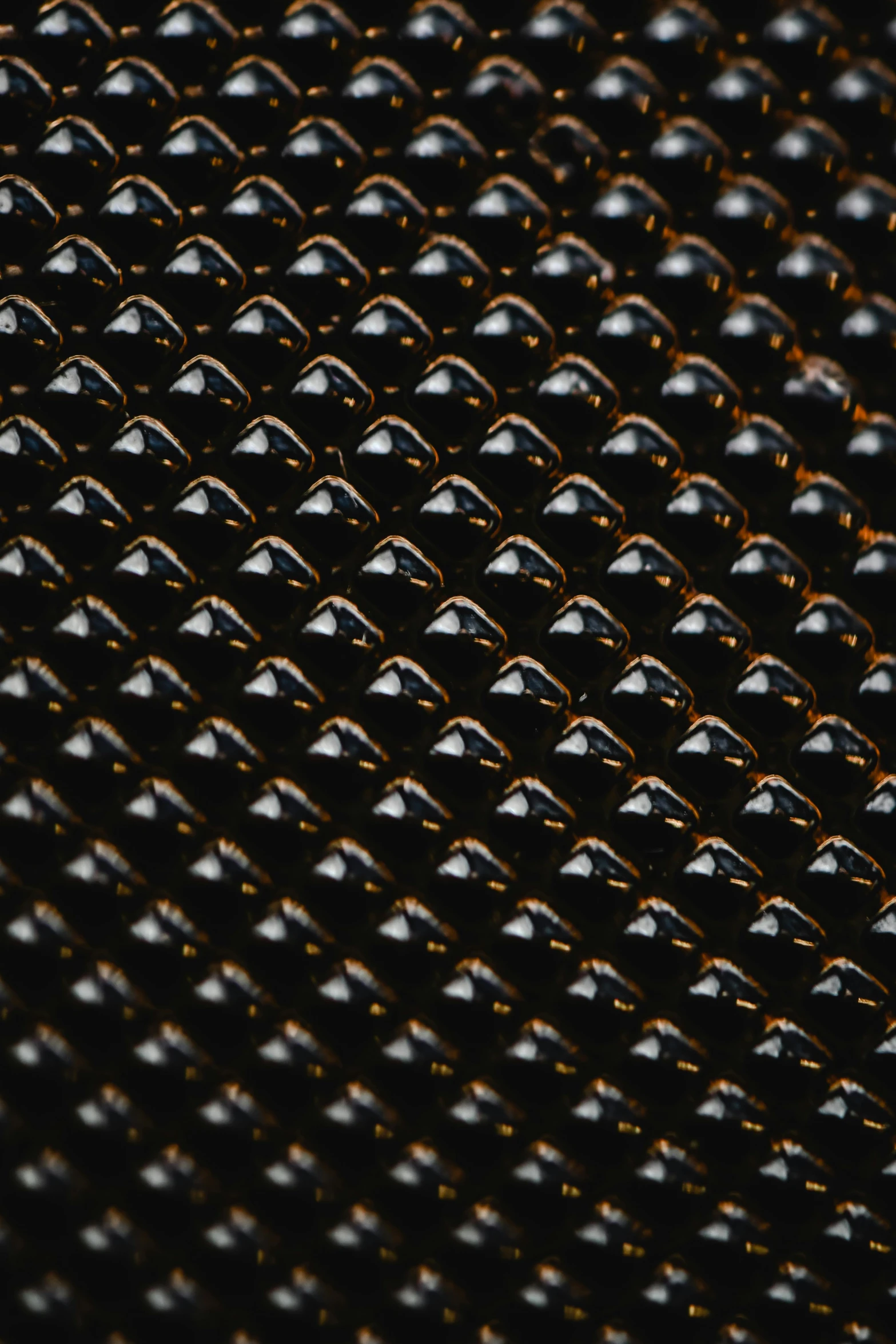 a close up of a metal grill grate, inspired by Andreas Gursky, unsplash, drooling ferrofluid. dslr, dramatic product lighting, lacquered, photographed for reuters