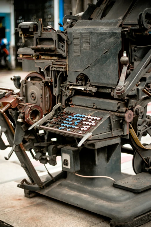 a machine that is sitting on top of a table, a silk screen, by Eduardo Paolozzi, unsplash, private press, rusty components, closeup photograph, made in 1800's, computer