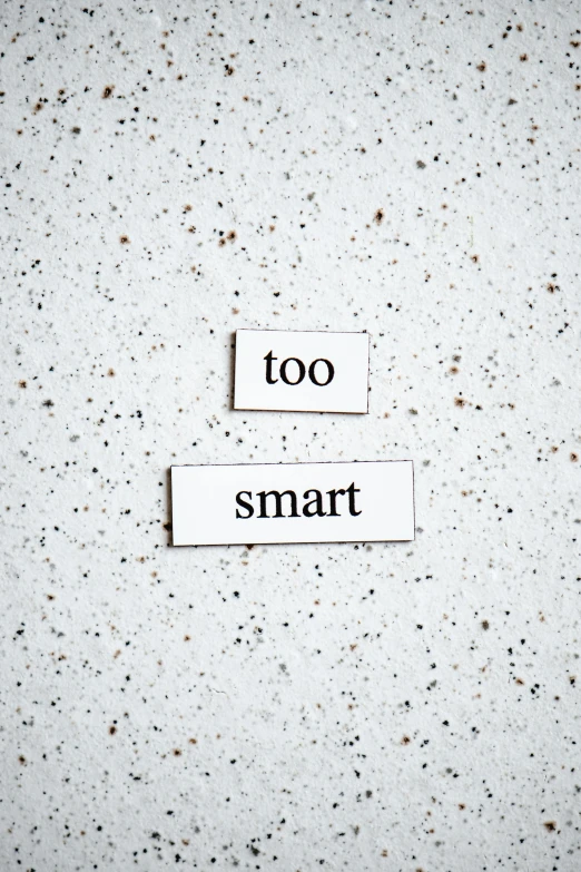 a piece of paper with the words too smart on it, by Everett Warner, trending on unsplash, made of all white ceramic tiles, magnetic, 15081959 21121991 01012000 4k, alessio albi