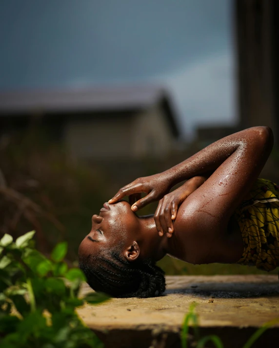 a woman that is laying down in the grass, by Chinwe Chukwuogo-Roy, pexels contest winner, art photography, body in water, brown skin, an ahoge stands up on her head, iridescent skin