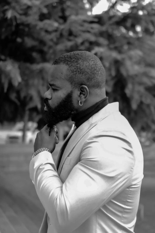 a black and white photo of a man in a suit, an album cover, inspired by Paul Georges, pexels contest winner, silver full beard, david uzochukwu, glamor profile pose, parks