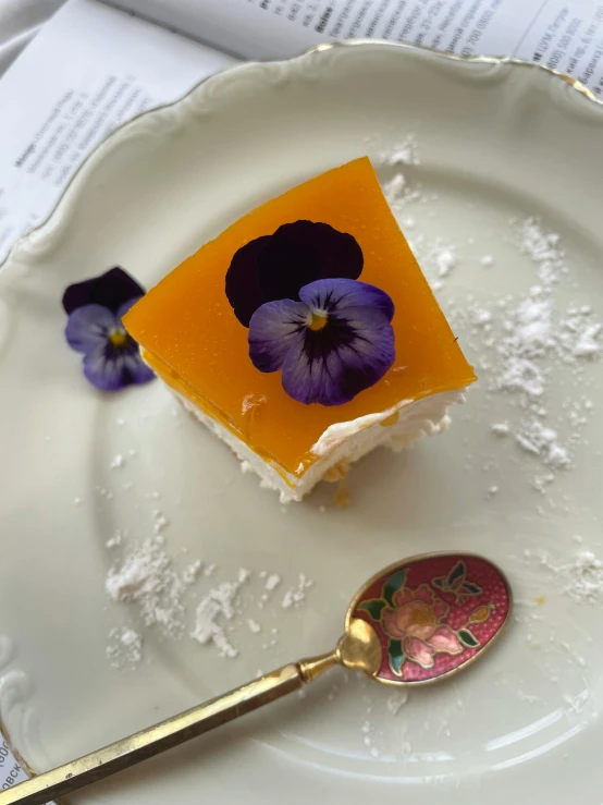 a piece of cake sitting on top of a white plate, by Alice Mason, edible flowers, orange extremely coherent, square, thumbnail