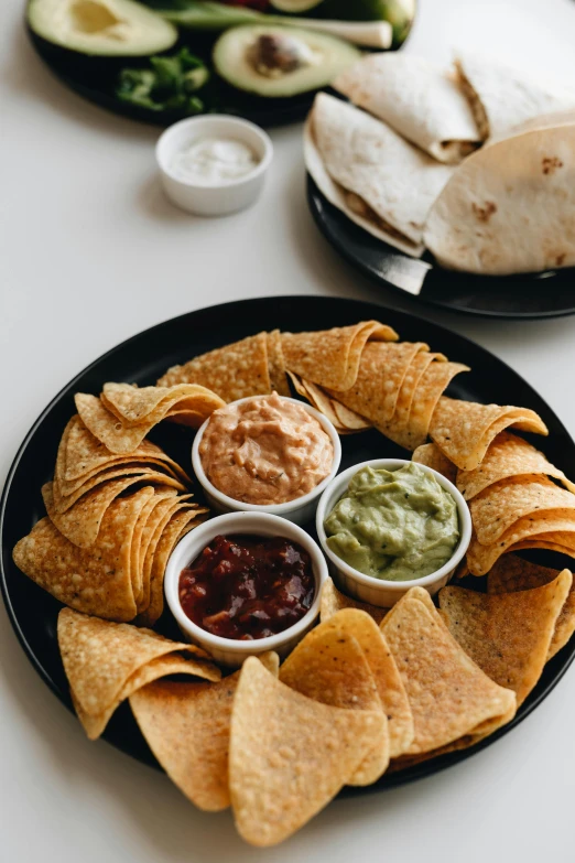 mexican chips with salsa and salsa cheese on the side