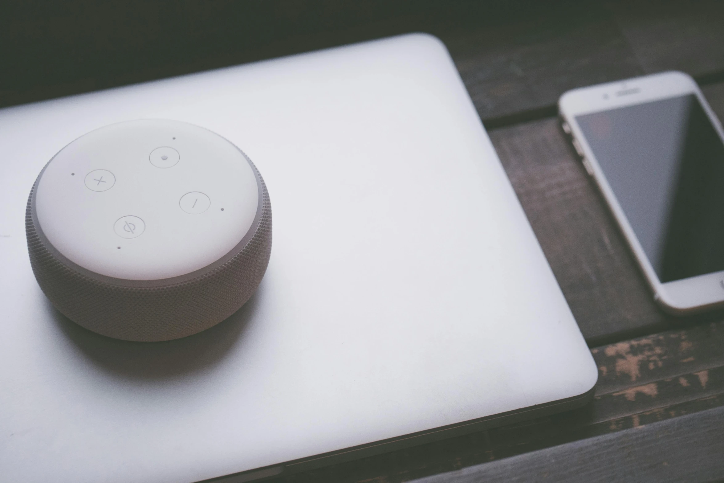 a smart device sitting on top of a table next to a cell phone, inspired by Eero Snellman, trending on pexels, computer art, alexa grace, circular shape, white plastic, polka dot