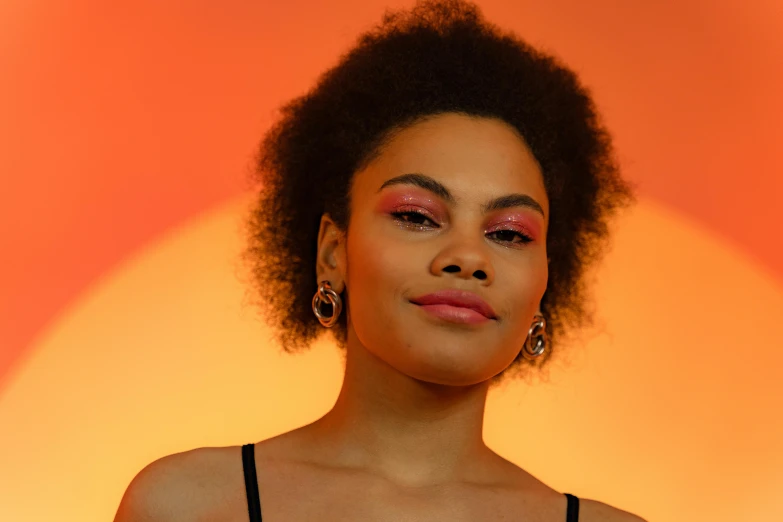 a woman in a black dress posing for a picture, an album cover, pexels contest winner, pink and orange colors, aida muluneh, soft portrait shot 8 k, headshot profile picture