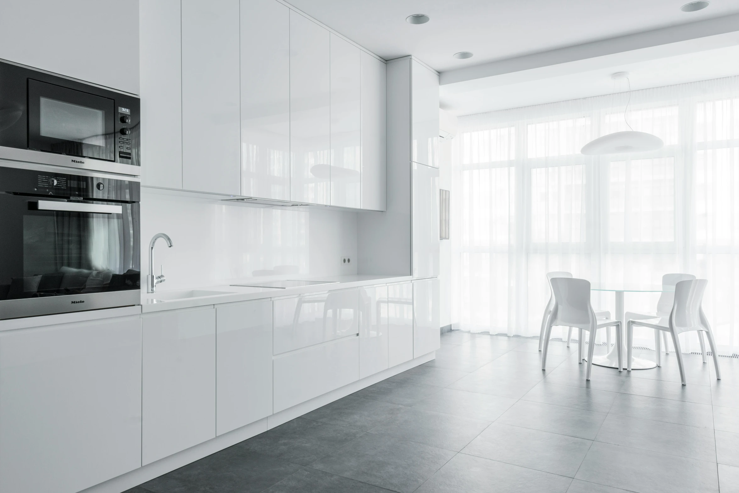 black and white po of kitchen area with appliances