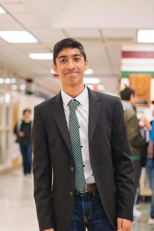 a man in a suit and tie standing in a hallway, reddit, jayison devadas, official photo, high school, profile image