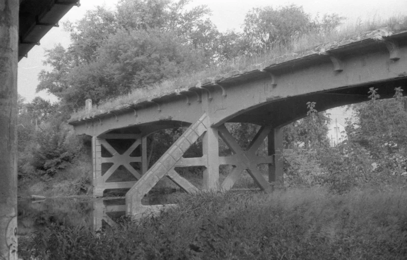 a black and white photo of a bridge, by Maurycy Gottlieb, alternate album cover, derelict, 2 0 0 2 photo, matt rhodes