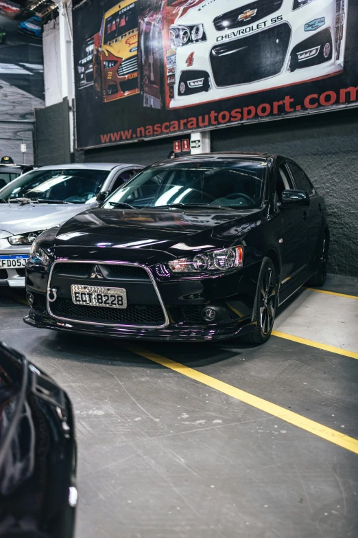 a parking garage with several cars in it