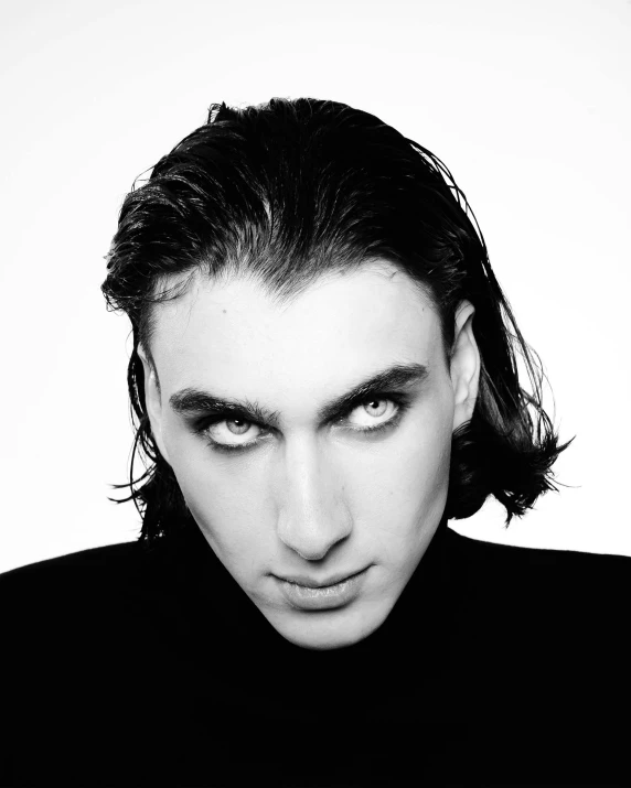 a black and white photo of a man with long hair, an album cover, antipodeans, green eyes!!!!, raf simons fashion couture, big eyebrows, blue symmetric eyes 24yo