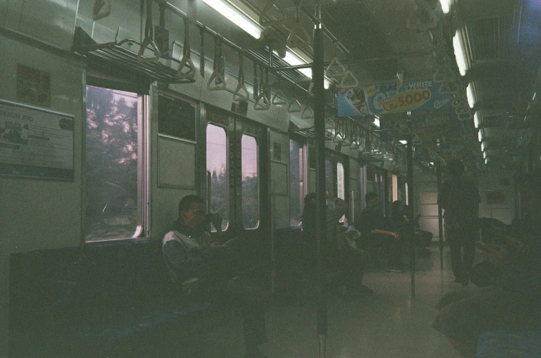 a group of people sitting next to each other on a train, unsplash, tonalism, deserted shinjuku junk, 1990s photograph, seoul, instagram picture