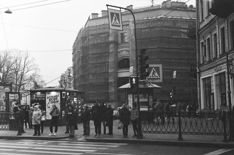 a group of people that are standing in the street