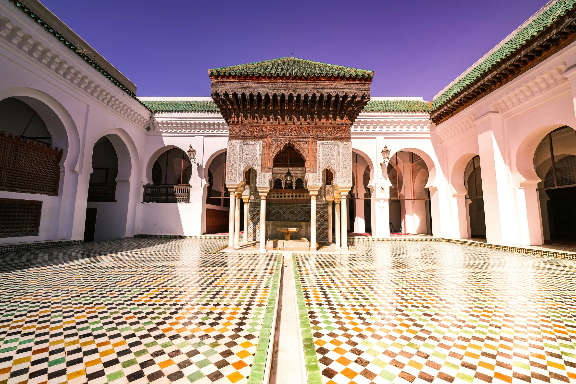 a large building with mosaic tiles on the floor and walls