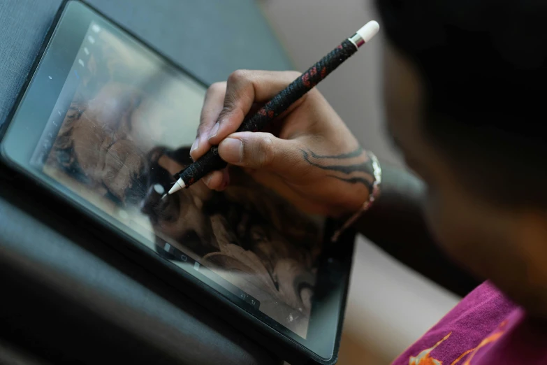 a man holding a tablet in his hand