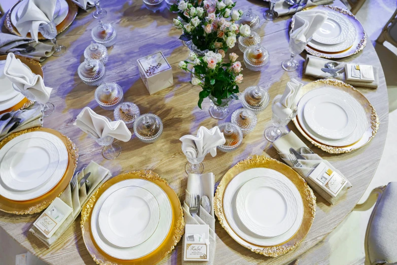 a close up of plates and cutlery on a table