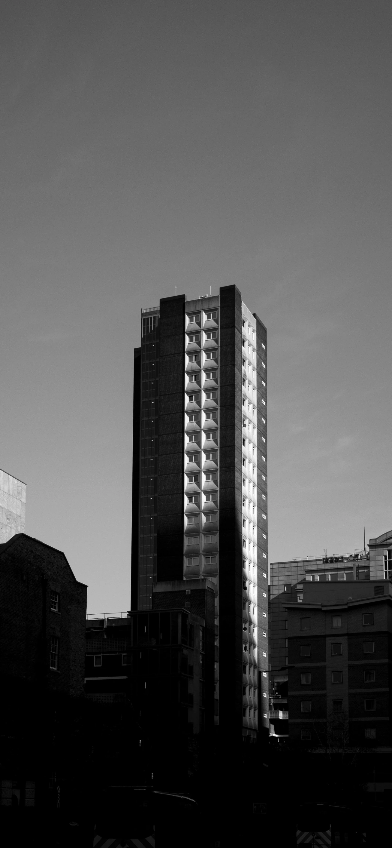 a black and white photo of some tall buildings, a black and white photo, inspired by Richard Wilson, brutalism, golden hour”, monochrome:-2, tall terrace, 1 7 8 0