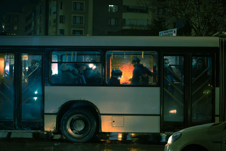 a city bus with its door open on the side in front of people