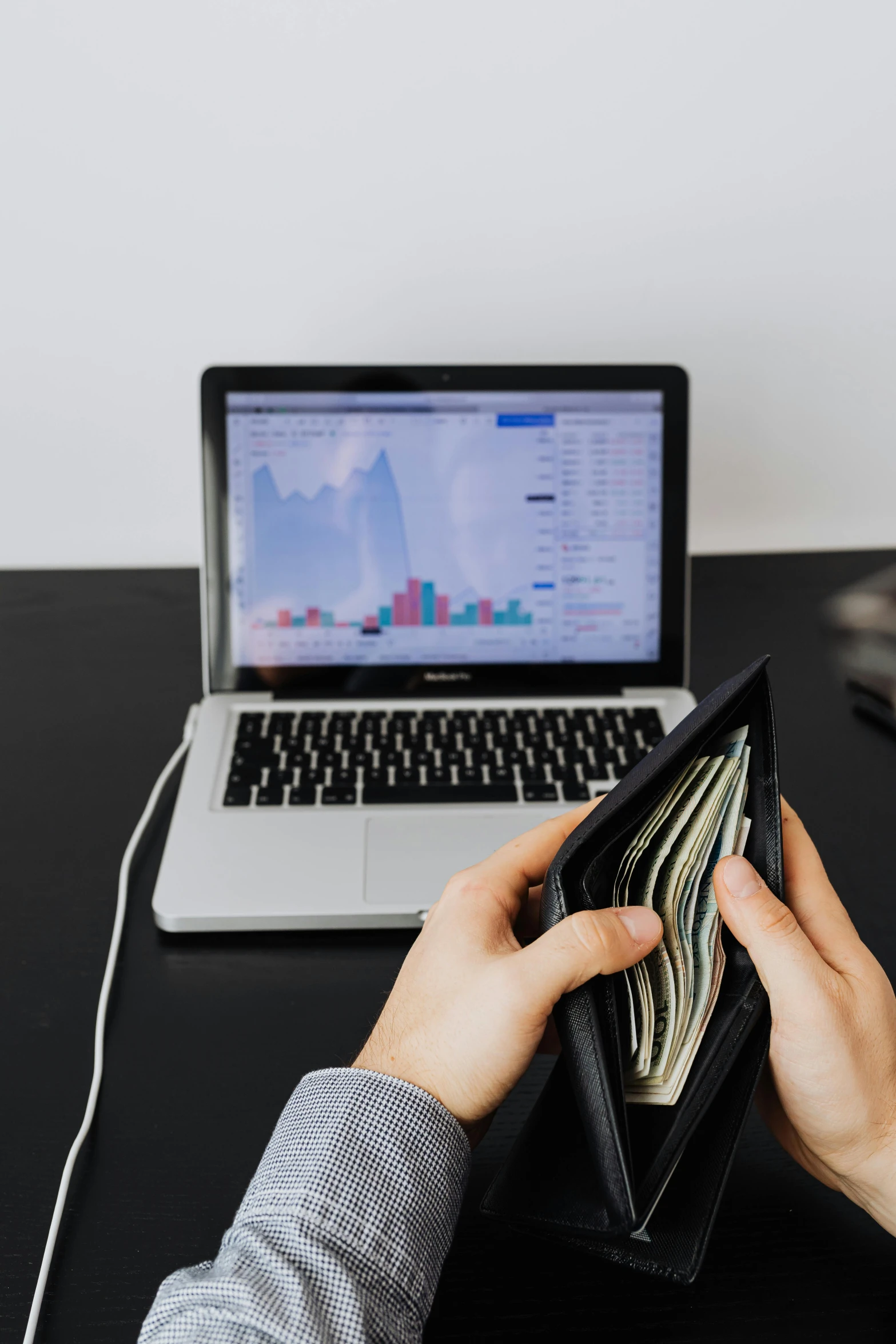 a person holding a wallet in front of a laptop, 2 5 6 x 2 5 6 pixels, trading, 15081959 21121991 01012000 4k, stacked image