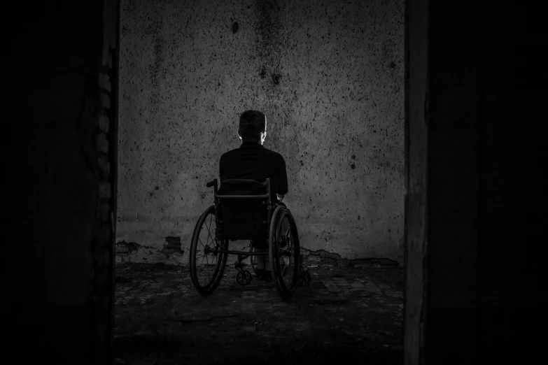 a man in a wheel chair is standing in an old building