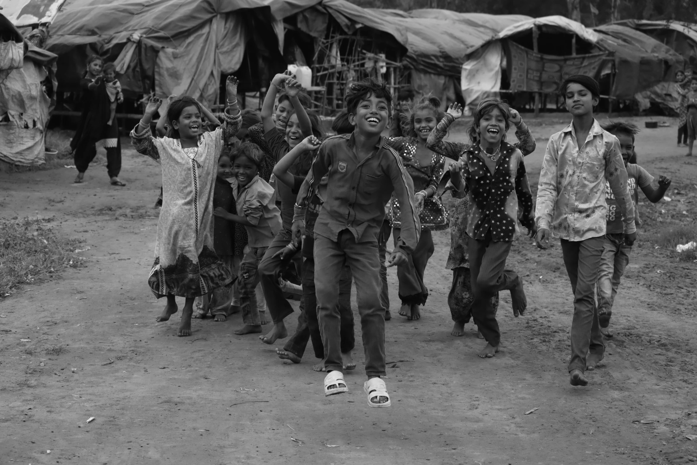 a group of people walking down a dirt road, an album cover, by John Hutton, fine art, cambodia, smiling and dancing, boy, 15081959 21121991 01012000 4k