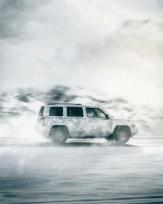 a large suv driving in the snow